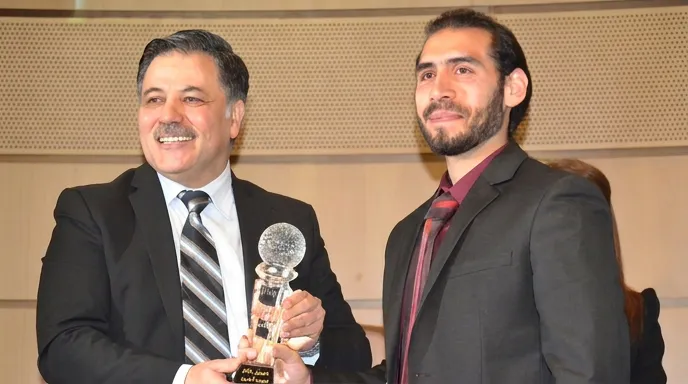 The Best Service Application award being presented on stage at Damascus University